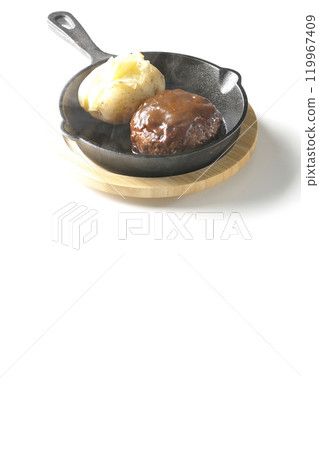 Hot hamburger steak and hot buttered potatoes photographed on a white background Hot hamburger steak and hot buttered potatoes photographed on a white background 119967409