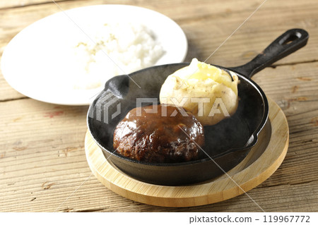 A set of hot hamburger steak, hot buttered potatoes and rice 119967772