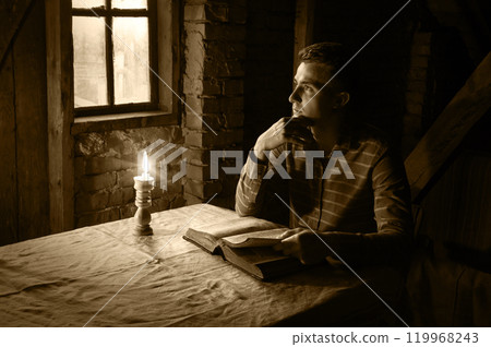 Man at the table reading book Man at the table reading book 119968243