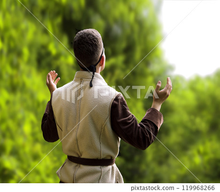 Praying man with raised hands Praying man with raised hands 119968266
