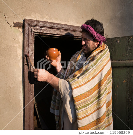 Man smears blood on doorposts Man smears blood on doorposts 119968269