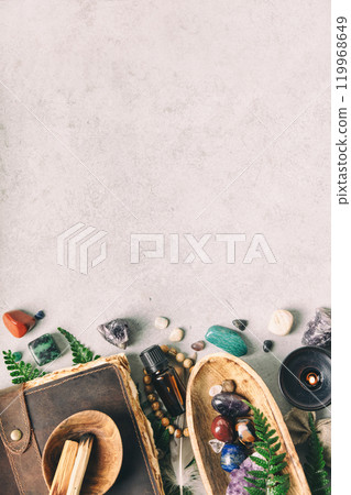 Rustic Arrangement of Crystals, Oils, and Herbs on Gray Stone Surface Rustic Arrangement of Crystals, Oils, and Herbs on Gray Stone Surface 119968649
