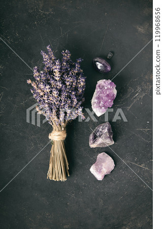 Lavender Bundle and Amethyst Crystals on Dark Surface Lavender Bundle and Amethyst Crystals on Dark Surface 119968656