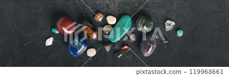 Mystical Flat Lay of Sage, Crystals, and Dried Herbs on Dark Surface banner 119968661