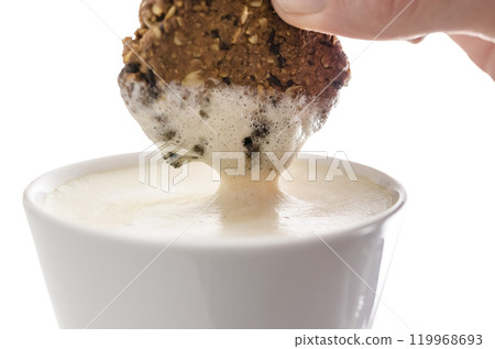 Dipping a cookie in cocoa 119968693