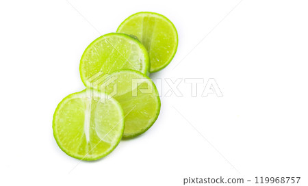 Whole limes and lime halves placed on a white background, highlighting the freshness and vibrant color of the fruit. Whole limes and lime halves placed on a white background, highlighting the freshness and vibrant color of the fruit. 119968757
