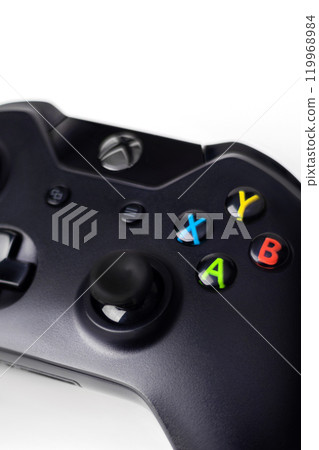 White Xbox One S Controller, Joystick on a black background close up vertical White Xbox One S Controller, Joystick on a black background close up vertical 119968984