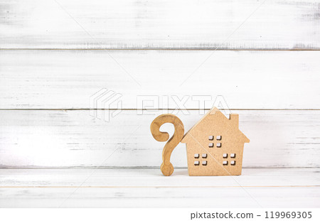 Home Ownership Questions: Wooden Question Mark with House Model on White Rustic Background 119969305