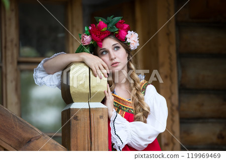 Beautiful Russian Slavic girl in national dress. 119969469