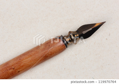 Fountain pen on an antique textured paper. Fountain pen on an antique textured paper. 119970764