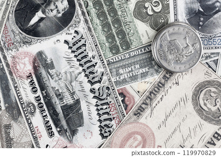 Old west US banknotes and silver certificates with silver dollar coins 119970829