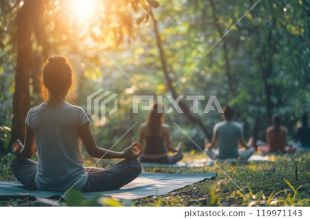People practicing mindfulness and meditation in serene forest. People practicing mindfulness and meditation in serene forest. 119971143