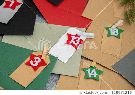Traditional twenty four days advent calendar before Christmas holidays. Numbers on envelopes Plastic free zero waste sustainable decoration. Winter cozy home Catholic traditions of Christmas countdown Traditional twenty four days advent calendar before Christmas holidays. Numbers on envelopes Plastic free zero waste sustainable decoration. Winter cozy home Catholic traditions of Christmas countdown 119971216