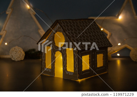 Cardboard Lantern handmade house Storytelling creating craft Christmas holiday decoration. Tactile hand-on activity. Master class progress of creative me-made gifts. Seasonal domestic life micro Cardboard Lantern handmade house Storytelling creating craft Christmas holiday decoration. Tactile hand-on activity. Master class progress of creative me-made gifts. Seasonal domestic life micro 119971229