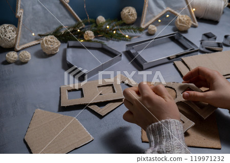 Cardboard Lantern handmade house Storytelling creating craft Christmas holiday decoration. Tactile hand-on activity. Master class progress of creative me-made gifts. Seasonal domestic life micro 119971232