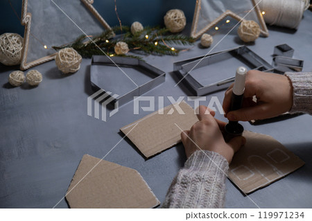 Cardboard paper Lantern House Sustainable Christmas preparation Diy process of making handmade. Step by step activity for children. Inclusive and responsible stress relief holiday hobby 119971234