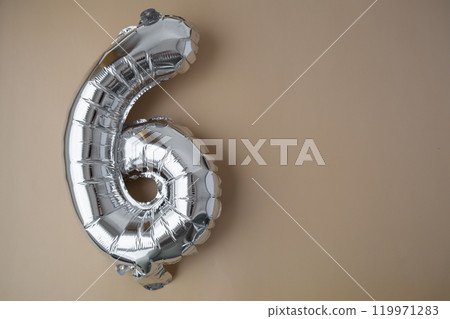 6 six metallic balloon on beige neutral background. Greeting card silver foil balloon number Happy birthday holiday concept. Copy space for text. Celebration party congratulation 6 six metallic balloon on beige neutral background. Greeting card silver foil balloon number Happy birthday holiday concept. Copy space for text. Celebration party congratulation 119971283