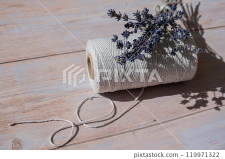 Dried lavender flowers on cotton rope. Esthetic aesthetic composition with copy space for wallpaper, black, template. Minimal eco style still life Dried lavender flowers on cotton rope. Esthetic aesthetic composition with copy space for wallpaper, black, template. Minimal eco style still life 119971322