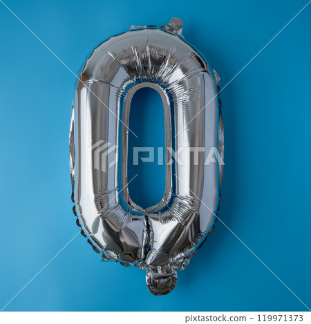 0 zero metallic balloon isolated on blue background. Greeting card silver foil balloon number Happy birthday holiday concept. Copy space for text. Celebration party congratulation 119971373