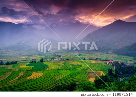 Sunset sky over mountain and lush rice field terraces in countryside 119971514