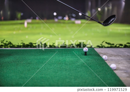 Practicing with golf swing on golf course at golf driving range 119971529