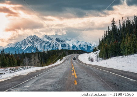 Road trip with rocky mountains on highway road in national park at Canada 119971560