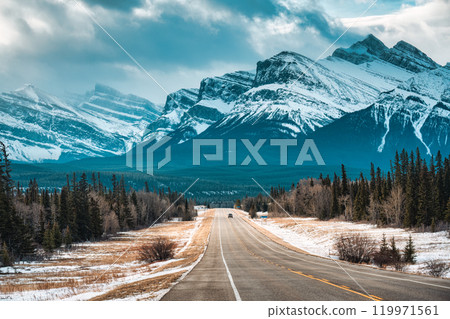 Rocky mountains over the road between autumn wilderness at Kootenay plains area, Canada 119971561
