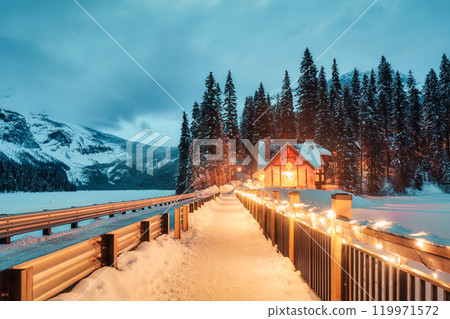 Emerald Lake with wooden lodge glowing in snowy pine forest on winter at Yoho national park, Canada Emerald Lake with wooden lodge glowing in snowy pine forest on winter at Yoho national park, Canada 119971572