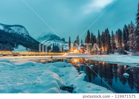 Winter scene of wooden lodge glowing on Emerald Lake at Yoho national park, Canada Winter scene of wooden lodge glowing on Emerald Lake at Yoho national park, Canada 119971575