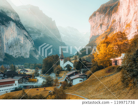 Lauterbrunnen valley with rustic village, famous church in autumn at Switzerland 119971738