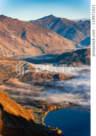 Landscape of sunlight over mountain and foggy on the lake in autumn at Roys Peak, New Zealand 119971821