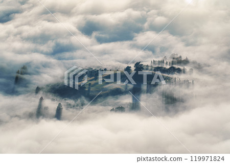 Scenic foggy mountain from summit of Roys Peak with Lake Wanaka in the morning at New Zealand 119971824