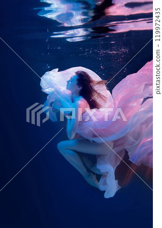 Vision. Sensual ballet dancer underwater, weightlessness and freedom. Blurred focus Vision. Sensual ballet dancer underwater, weightlessness and freedom. Blurred focus 119972435