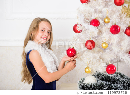 Winter holiday concept. Family holiday concept. Girl velvet dress feel festive near christmas tree. Very special time of year. Spread christmas cheer. Kid happy because holiday season arrives 119972716