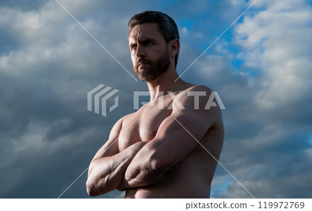 shirtless muscular man. macho man with muscular torso. athletic man on sky background 119972769