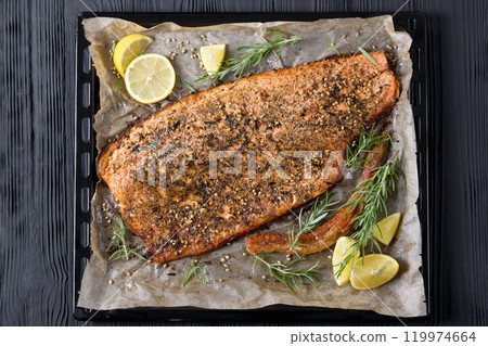 baked salmon fillet on baking tray, top view 119974664