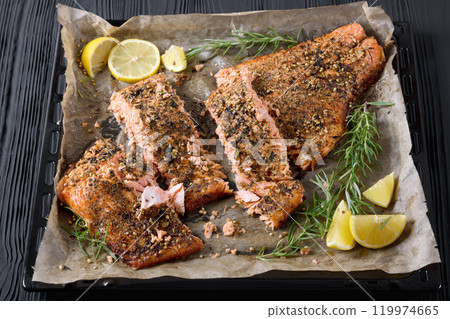 baked salmon fillet on baking tray, top view baked salmon fillet on baking tray, top view 119974665