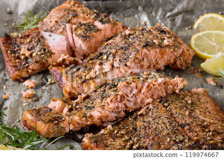 baked salmon fillet on baking tray, top view baked salmon fillet on baking tray, top view 119974667