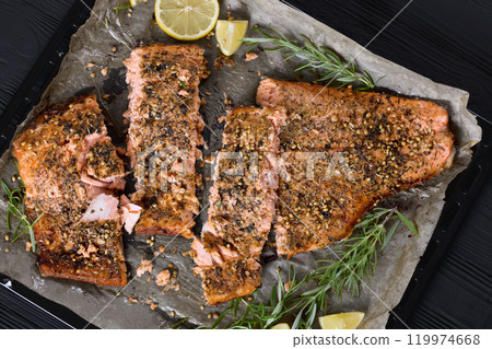 baked salmon fillet on baking tray, top view baked salmon fillet on baking tray, top view 119974668