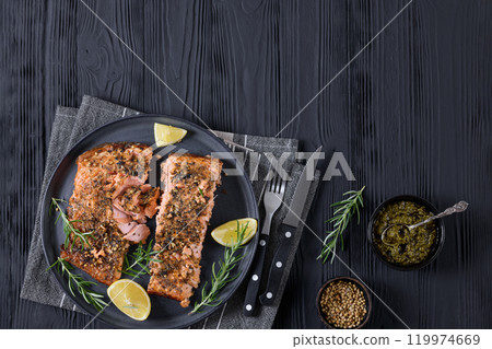 baked salmon fillet with lemon, rosemary on plate baked salmon fillet with lemon, rosemary on plate 119974669