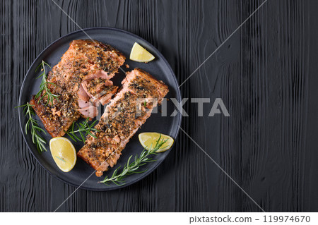 baked salmon fillet with lemon, rosemary on plate baked salmon fillet with lemon, rosemary on plate 119974670