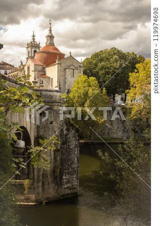 View of the river, ancient stone bridge and church in the city of Amarante in Portugal View of the river, ancient stone bridge and church in the city of Amarante in Portugal 119974698