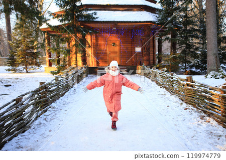 a child joyfully running toward a cozy home, surrounded by a beautiful winter landscape 119974779