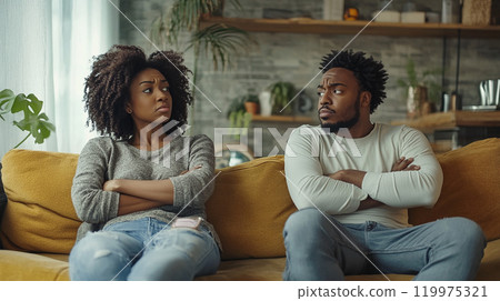 Couple arguing in the living room 119975321