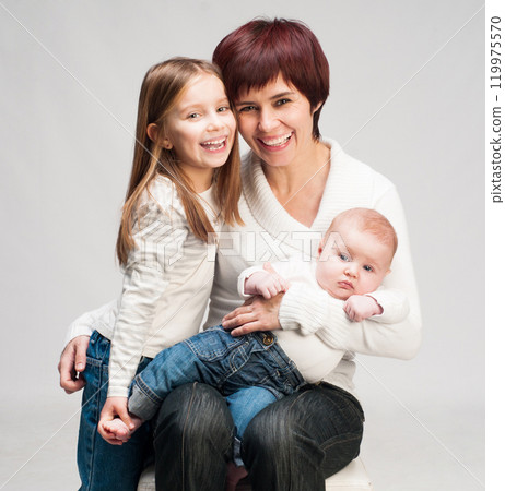 mother with two young daughters mother with two young daughters 119975570