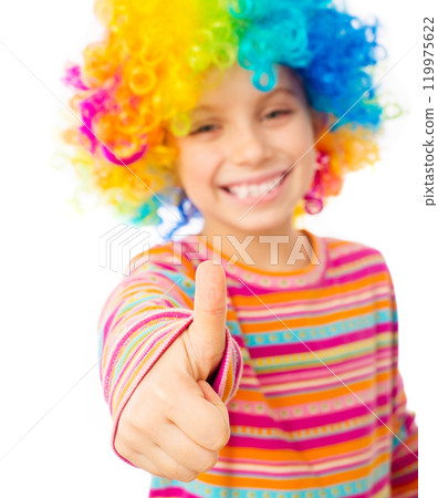 smiling little girl in clown wig with thumbs up isolated on white background 119975622