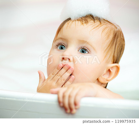 cute little baby face in the bathroom 119975935