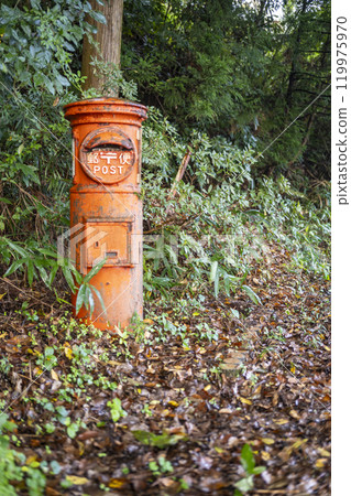 Rusty round post in the forest 119975970
