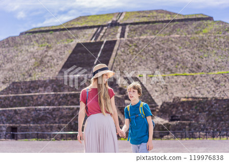 Mother and son tourists exploring Teotihuacan, Mexico. Cultural heritage, ancient ruins, and archaeological adventure concept Mother and son tourists exploring Teotihuacan, Mexico. Cultural heritage, ancient ruins, and archaeological adventure concept 119976838