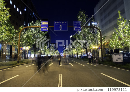 Yellow illumination with blue signboard, street photography 119978111